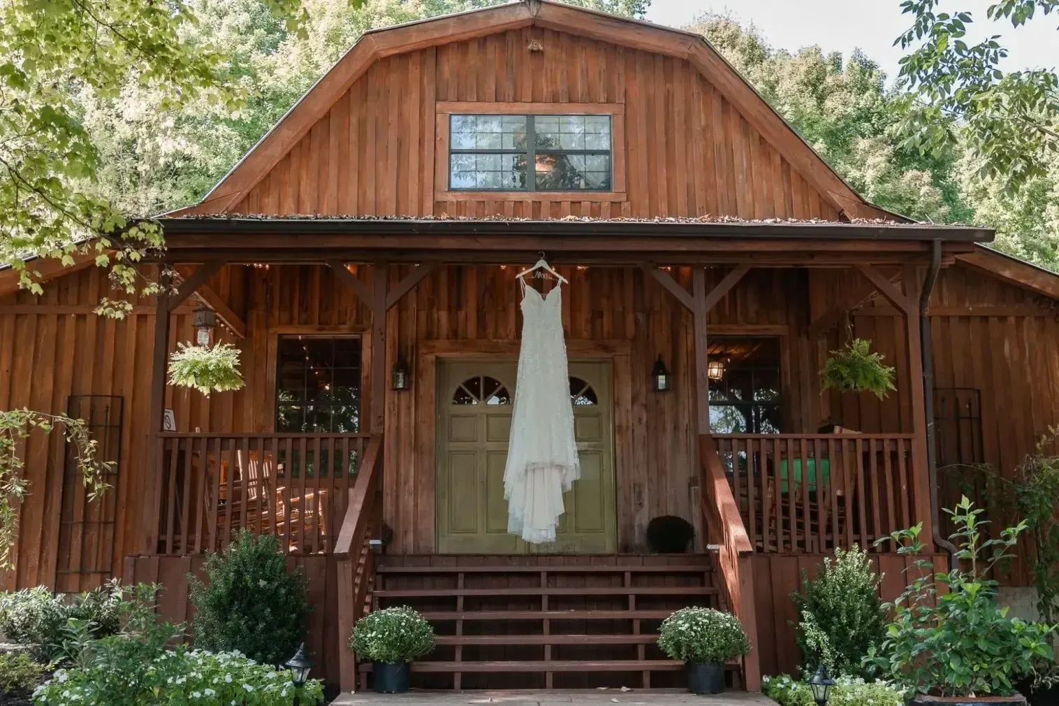 Wedding dress hanging at the barn entrance at Chappell Acres